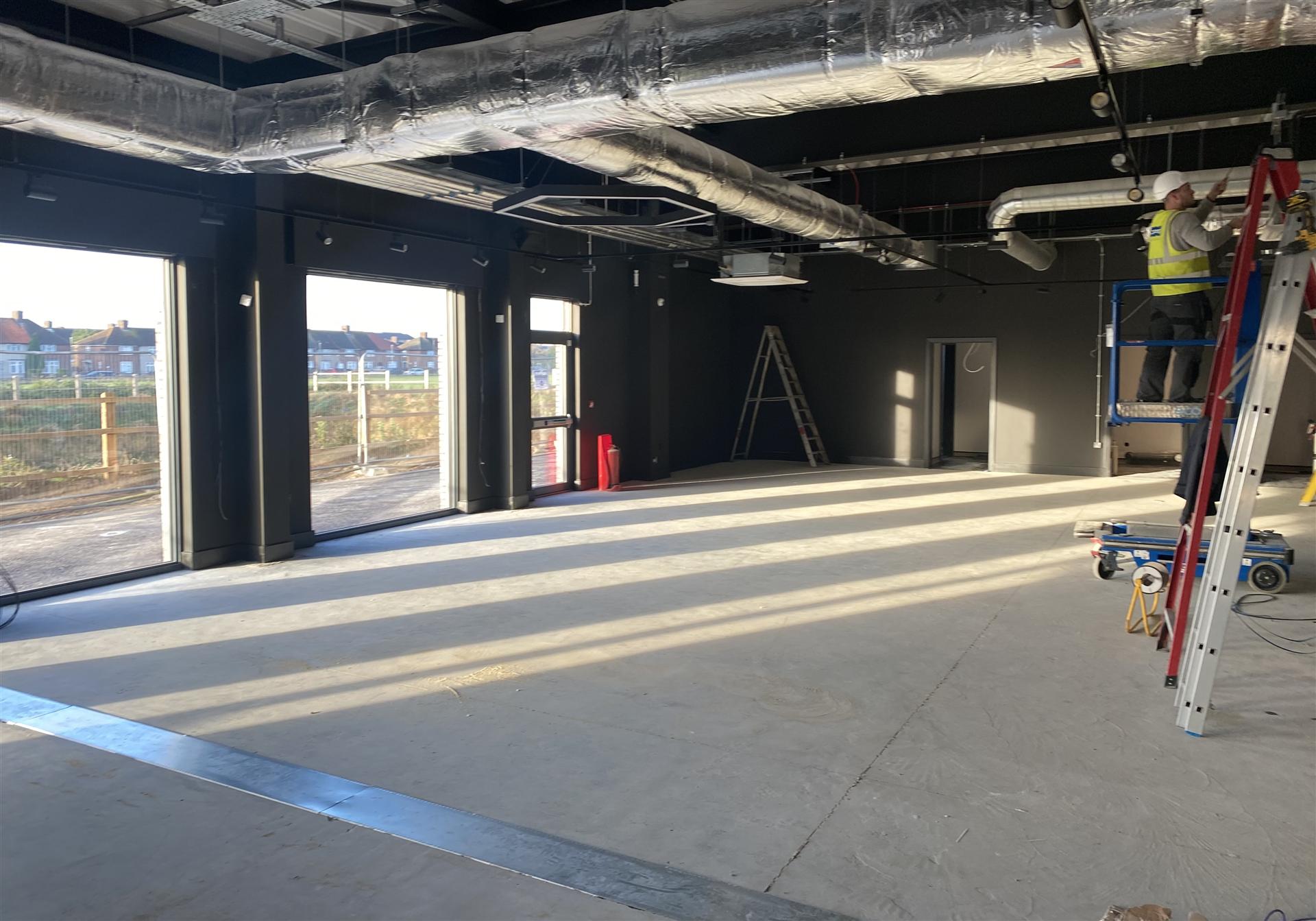 Large commercial warehouse with dark painted interior, Essex
